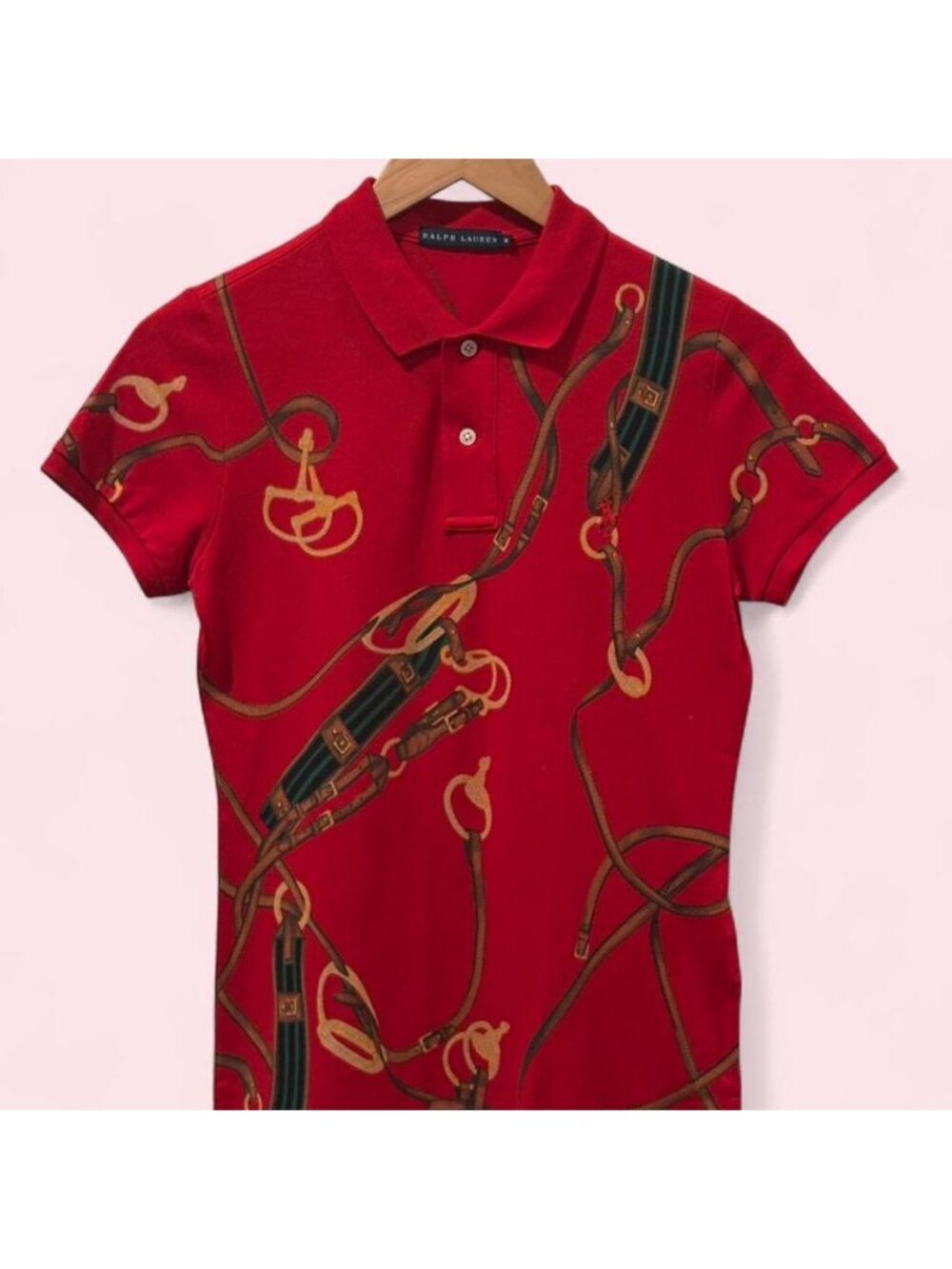 Ralph Lauren Women’s red polo shirt with belt and buckle design.